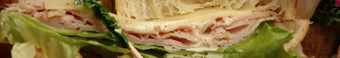 Eating Deli Sandwich at Monmouth Clubhouse Deli restaurant in Ocean Township, NJ.